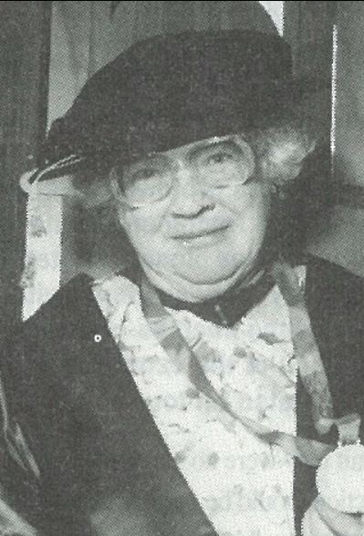 A 1993 black and white photograph of Janet Frame holding a medal (unknown photgrapher)