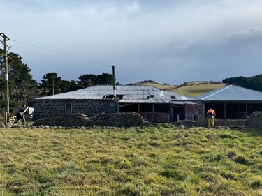 Stonemason repairing stone sheep yards