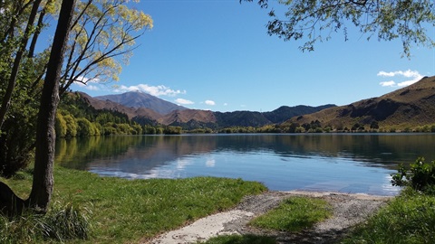 view of lake and mountains at Wildlife Reserve campsite