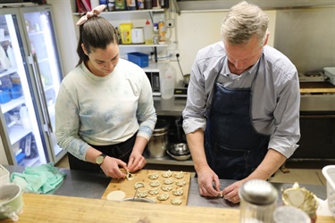 Kat Rivison and Mayor Gary Kircher making mushroom dumplings for the Soup Sipper