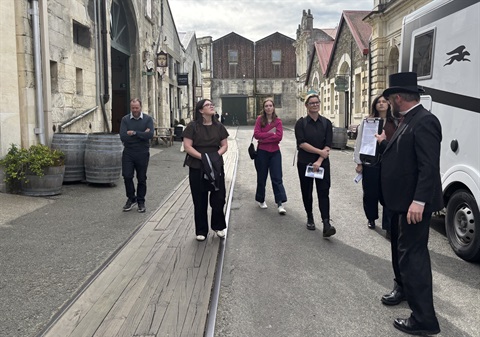 MBIE reps walk along Harbour Street with Council officers